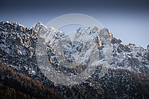 Beautiful snowy winter mountain range landscape in julian alps, slovenia