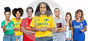 Beautiful soccer fan from Brazil with supporters from Spain Ghana Mexico Qatar Argentina and France