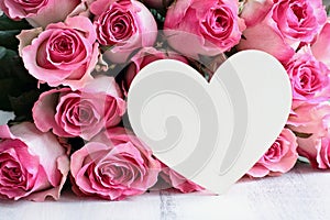 Beautiful Soft Pink Rose with Blank Wooden Heart Background