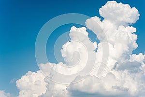 Beautiful soft white fleecy cloud on blue sky background.