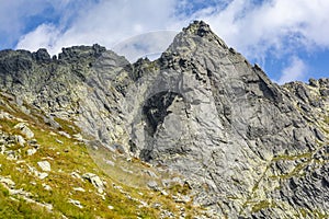 The beautiful solid wall of the Wolowa Turnia Volia veza peak with the climbing classics of the Slovak Tatras