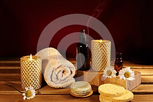 Beautiful Spa. Aroma Therapy with Herbal Oil, Natural Soap and Relaxation Candles. Wooden Color and Warming Towels