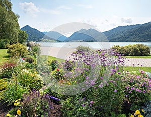 Beautiful spa garden Schliersee with flower beds, promenade and alps view, bavaria