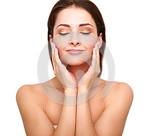 Beautiful spa woman with clean beauty skin touching her face