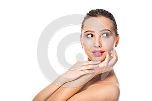 Beautiful Spa woman with clean well groomed skin, natural makeup, pink lips on white background looking away