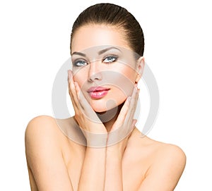 Beautiful spa woman touching her face