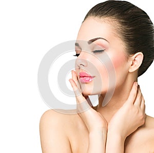 Beautiful spa woman touching her face