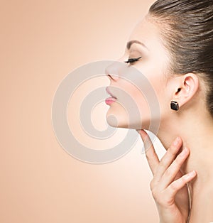 Beautiful spa woman touching her face