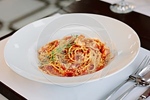 Beautiful spaghetti pasta at traditional italian restaurant.