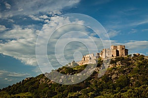 Beautiful Spanish old castle over a hill and a beautiful sky