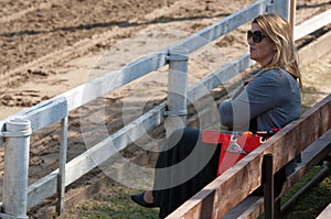 Beautiful spectator on tribune during The Dressage and jumping c