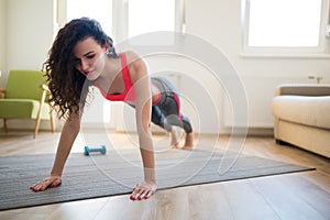 Beautiful sportive woman stretching and working out