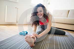 Beautiful sportive woman stretching and working out