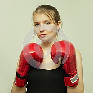 Beautiful sports girl with boxing gloves