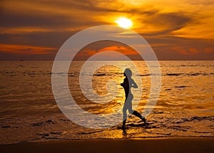 The beautiful, sports girl bzhit on the seashore