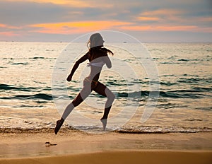 The beautiful, sports girl on the seashore