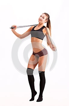 Beautiful sportsgirl with skipping rope