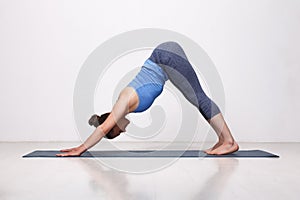 Beautiful sporty fit yogi girl practices yoga