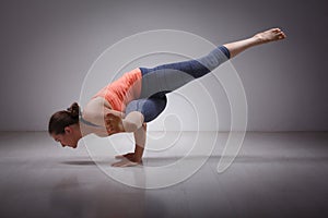 Beautiful sporty fit yogi girl practices yoga