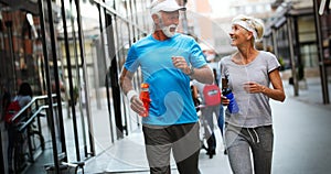 Beautiful sporty mature couple styaing fit with sport