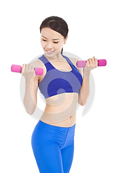 Beautiful sporty muscular woman working out with dumbbells