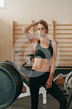 Beautiful sporty woman in old school gym