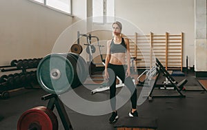 Beautiful sporty woman in old school gym