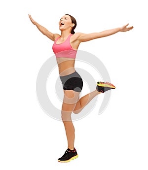 Beautiful sporty woman running or jumping