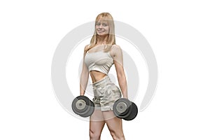 Beautiful sporty young woman in sportswear is exercising with dumbbells Isolated on white background.. blonde in a white sports t-