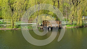 Beautiful spring alcove on lake and forest. Springtime season Abstract natural background. Blurry silhouettes of many