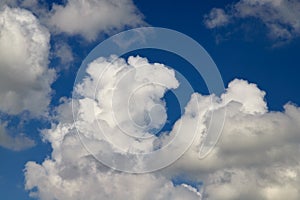 Beautiful, spring clouds in the blue sky photo