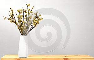 Beautiful spring flower arrangement.Empty podium for product with fresh willow flowers,elegant beauty concept.Stage for product