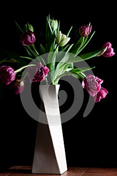 Beautiful spring flowers black background, vertical