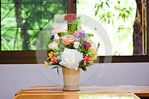 Beautiful spring flowers in a glass vase on meeting room,businees room