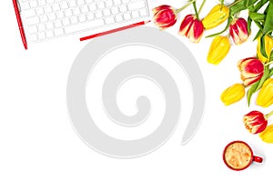 Beautiful spring mockup. White modern keyboard, pencil, pen, small red cup of coffee and bunch of bright tulips on white