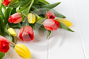 Beautiful spring tulips on white table