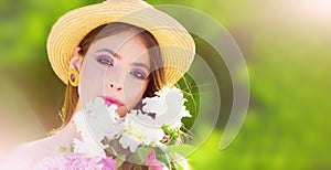 Beautiful spring woman in blooming park. Portrait of young beautiful woman in spring blossom nature. Beauty woman face