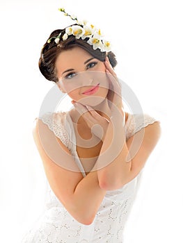 Beautiful spring woman with pure skin and flowers