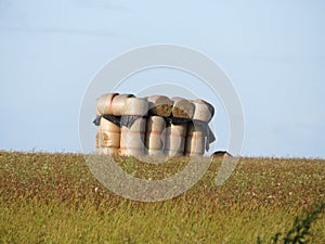 Beautiful stacked straw bullets creating an artistic figure in the field photo