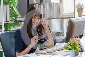 Beautiful staff are happy at the office desk