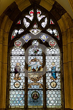 Beautiful stained glass panes in arched window