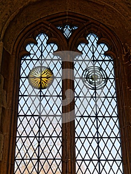 Beautiful stained glass window with symbols of sun and rose