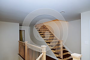 Beautiful stair railing and carpeted steps in house