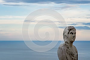 Beautiful statue from the belvedere, the so-called Terrazza dell`infinito, The Terrace of Infinity seen on the sunset, Villa Cimbr photo