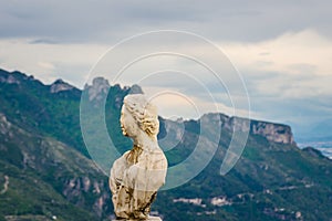 Beautiful statue from the belvedere, the so-called Terrazza dell`infinito, The Terrace of Infinity seen on the sunset, Villa Cimbr photo