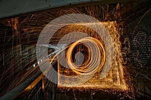 Beautiful steel wool light effect in a painting with unique patterns at nighttime in Milan, Italy