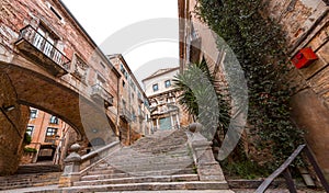 Beautiful steps and archway of the Pujada de Sant Domenec located in the Jewish Quarter of Girona, Spain photo