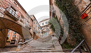 Beautiful steps and archway of the Pujada de Sant Domenec located in the Jewish Quarter of Girona, Spain