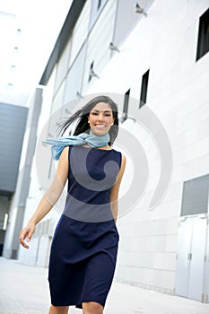 Beautiful stewardess walking to convention center photo