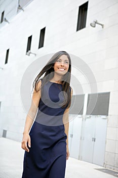 Beautiful stewardess walking to convention center